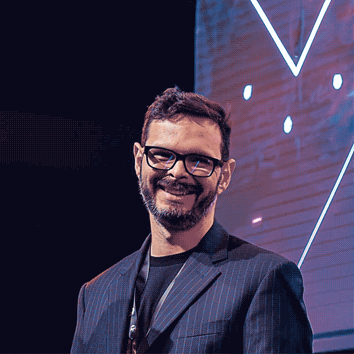 Darren Bacon speaking on stage